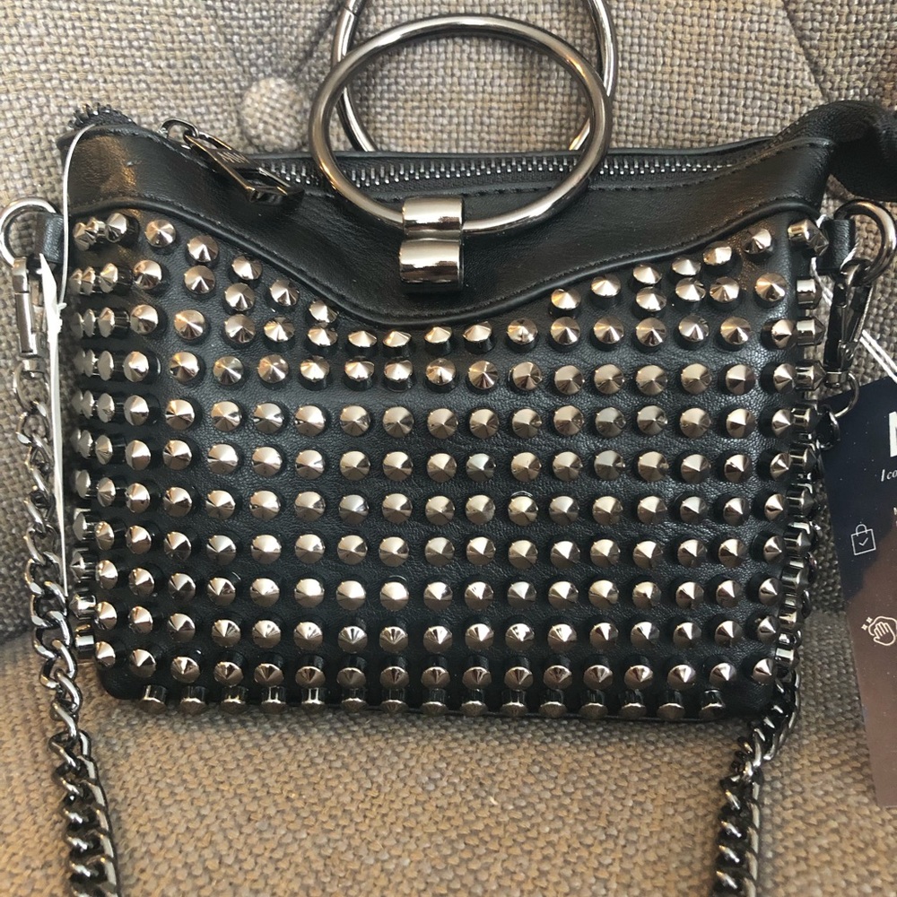 Cute little studded crossbody. Detachable chain.